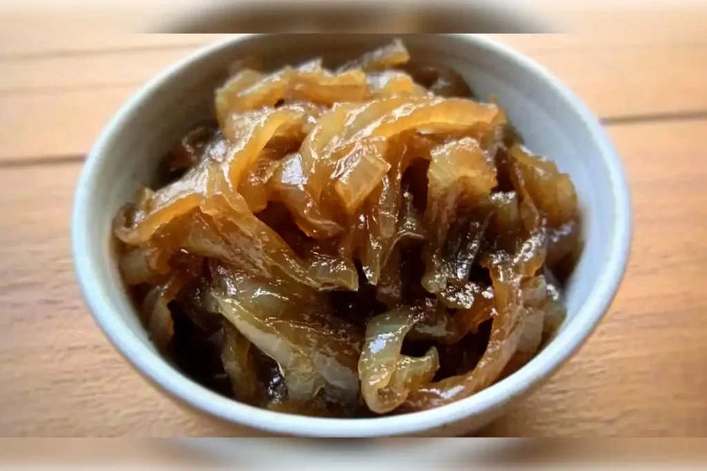 Bowl of caramelized onions showcasing the rich, golden-brown color perfect for slow-cooked dishes like crockpot meals.